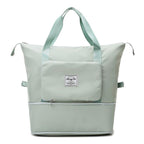 Sac à langer vert menthe avec poches multiples, design moderne et spacieux, idéal pour les parents. Accessoire pratique pour bébé.