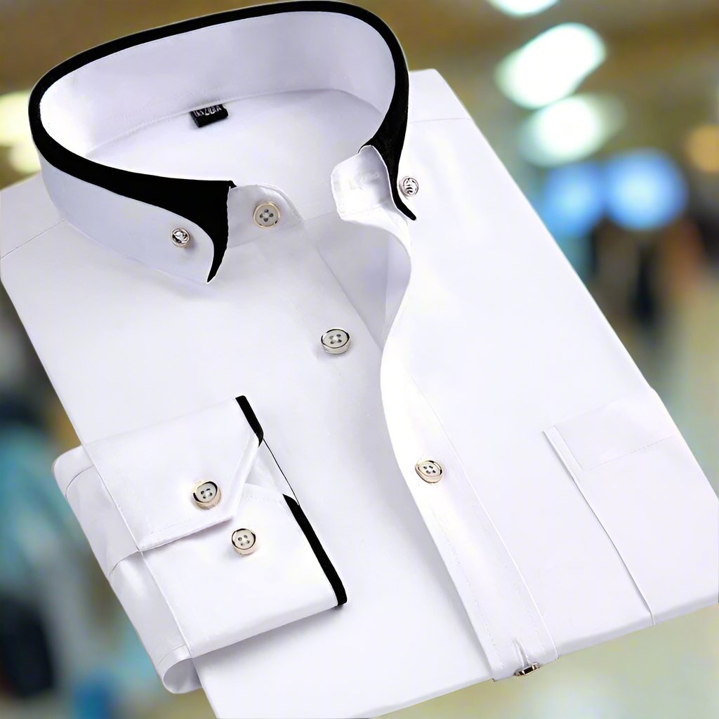 Chemise blanche élégante avec col et poignets contrastés noirs, boutons blancs, sur fond flou. Mode masculine, vêtement formel, style moderne.