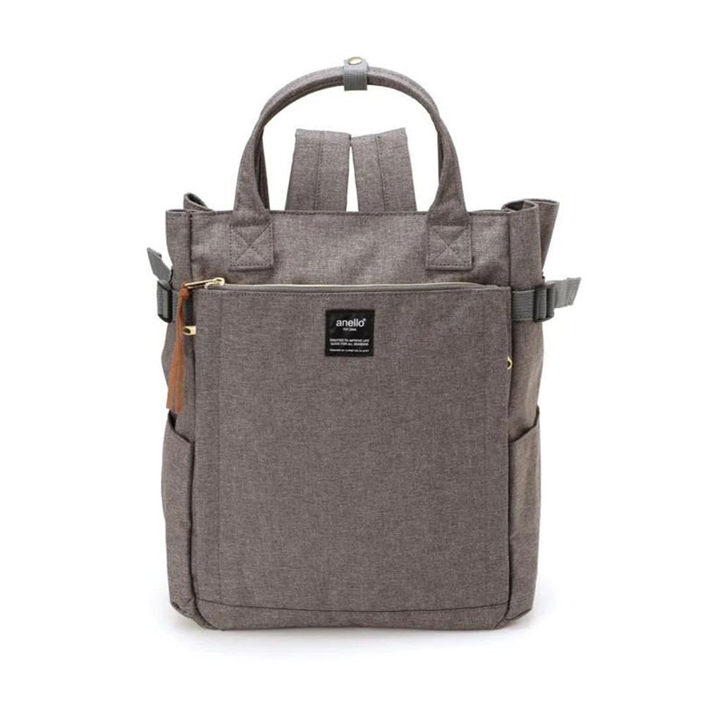 Sac à dos Anello gris en toile, design moderne avec poches multiples, fermeture éclair dorée, idéal pour voyage, école ou travail.