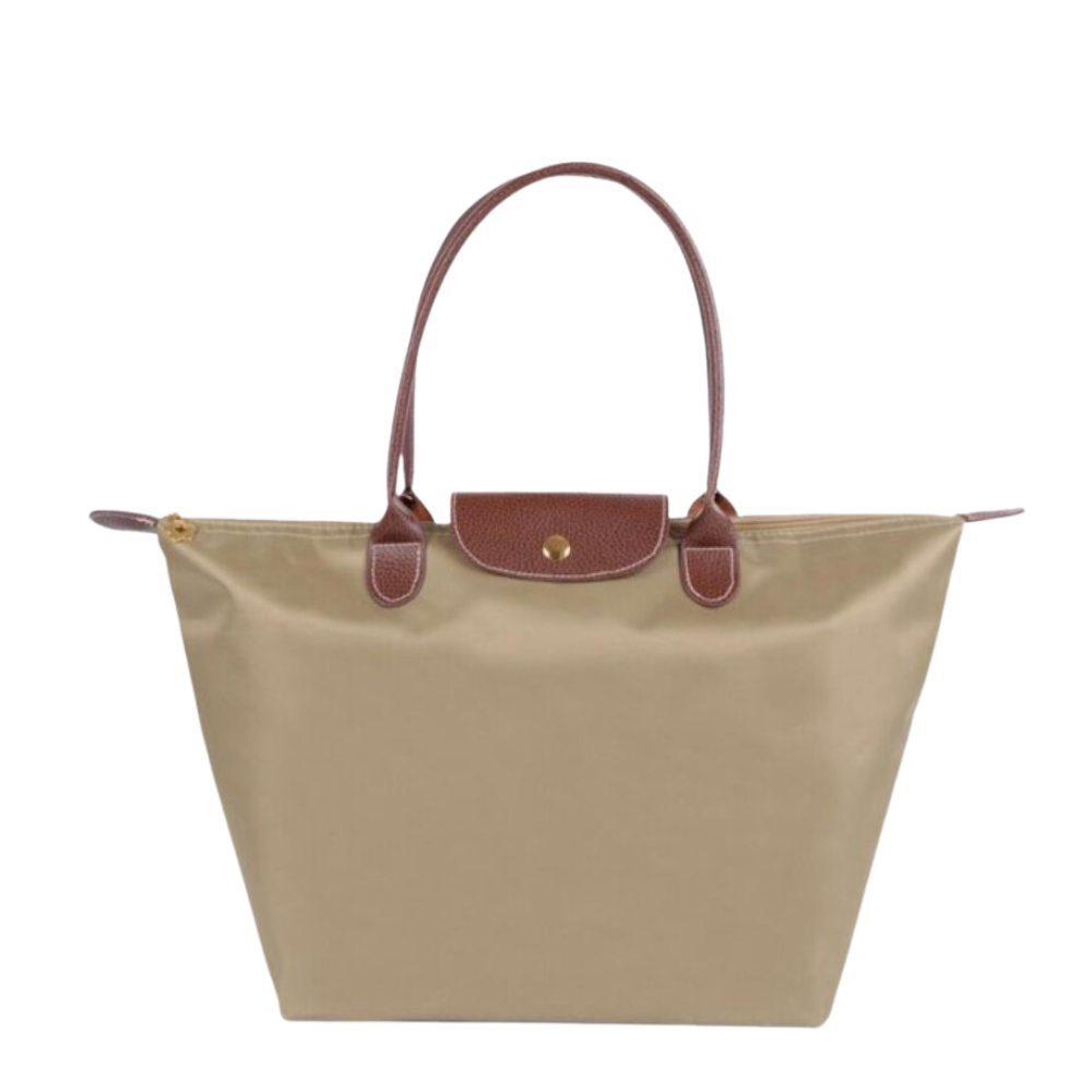 Sac à main beige en toile avec anses et rabat en cuir marron, style cabas, élégant et pratique pour femme, idéal pour usage quotidien.