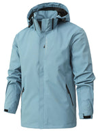 Veste imperméable bleu clair avec capuche, fermeture éclair frontale, poches zippées noires. Idéale pour randonnée, activités extérieures.