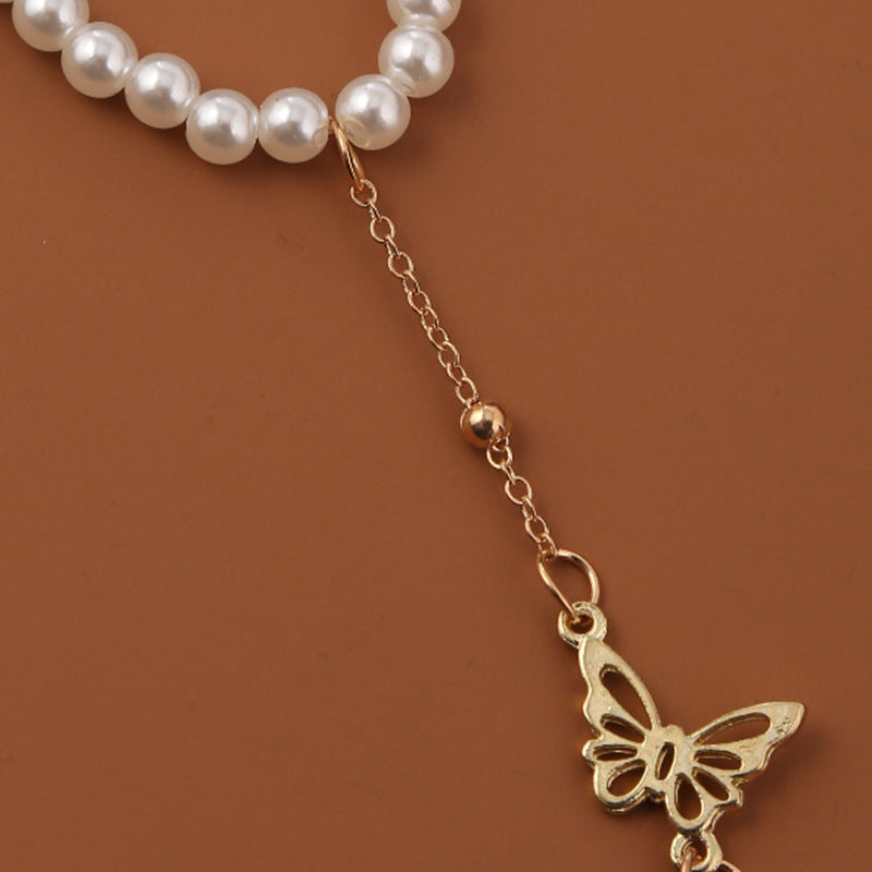 Bracelet en perle avec pendentif papillon
