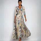 Robe longue élégante à motifs floraux, manches trois-quarts, fond beige, idéale pour soirées ou événements formels. Mode féminine chic.
