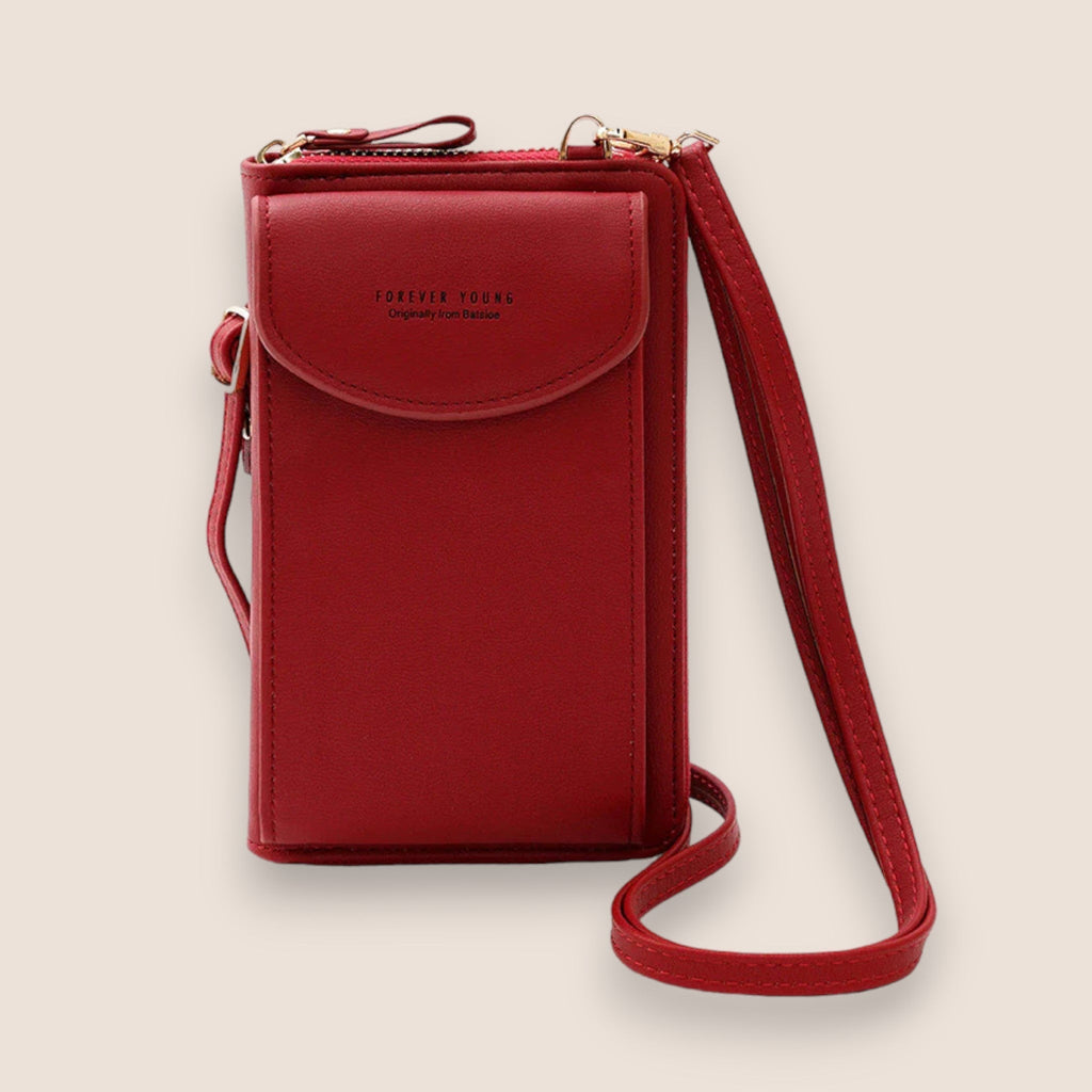 Sac à bandoulière rouge en cuir synthétique, design compact avec rabat, idéal pour smartphone et accessoires. Mode tendance, pratique et élégant.
