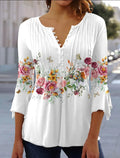 Blouse blanche à manches longues avec motif floral coloré, boutons sur le devant. Mode féminine élégante, style décontracté, tendance printemps.