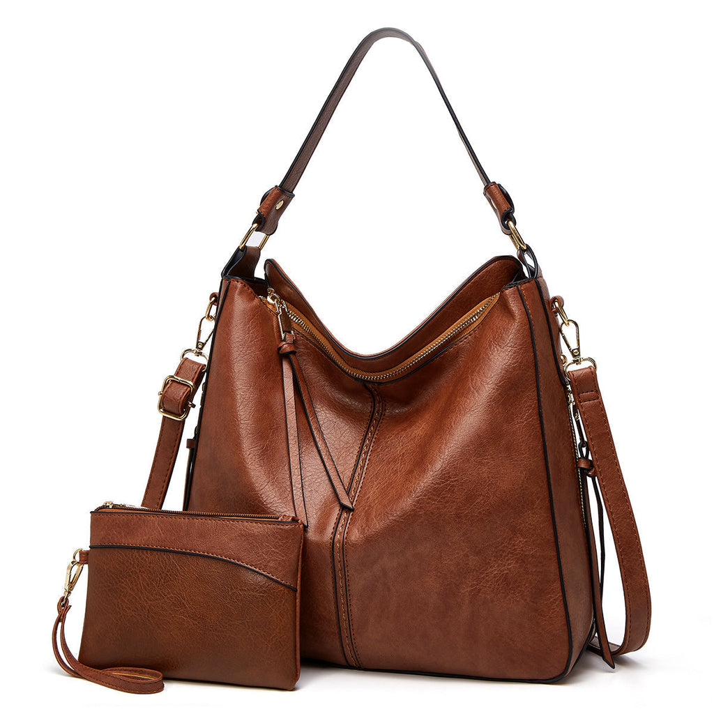 Sac à main en cuir marron avec pochette assortie, bandoulière réglable, design élégant et moderne, parfait pour la mode féminine et le quotidien.