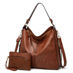 Sac à main en cuir marron avec pochette assortie, bandoulière réglable, design élégant et moderne, parfait pour la mode féminine et le quotidien.