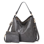 Sac à main en cuir gris avec pochette assortie, design élégant et moderne, idéal pour femme, mode, accessoires, tendance automne-hiver.