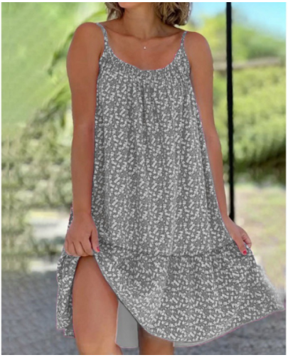 Robe d'été grise à motifs floraux blancs, sans manches, portée par une femme. Mode féminine, tenue décontractée, style estival élégant.