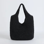 Sac à main noir en crochet, design moderne et élégant, parfait pour un style décontracté. Accessoire tendance pour femme, idéal pour l'été.