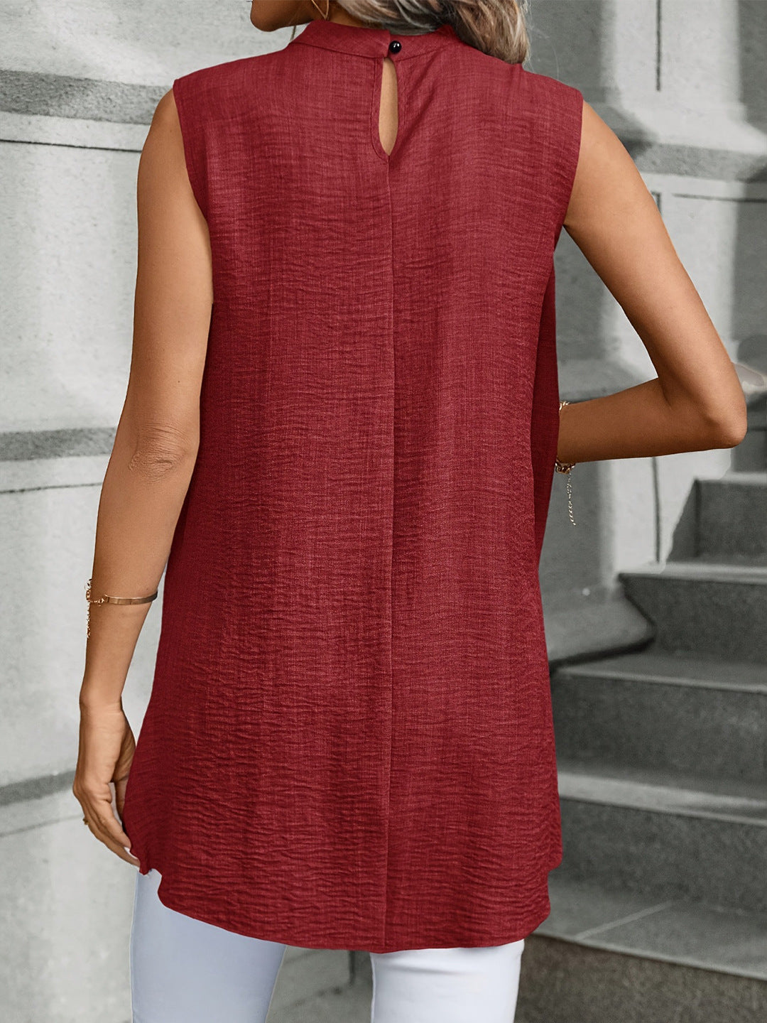 Irregular draped sleeveless top