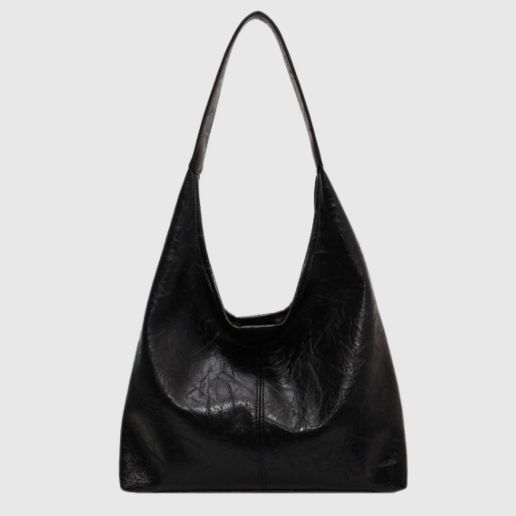 Sac à main noir en cuir texturé, design minimaliste, anse unique, style moderne et élégant, accessoire de mode pour femme.