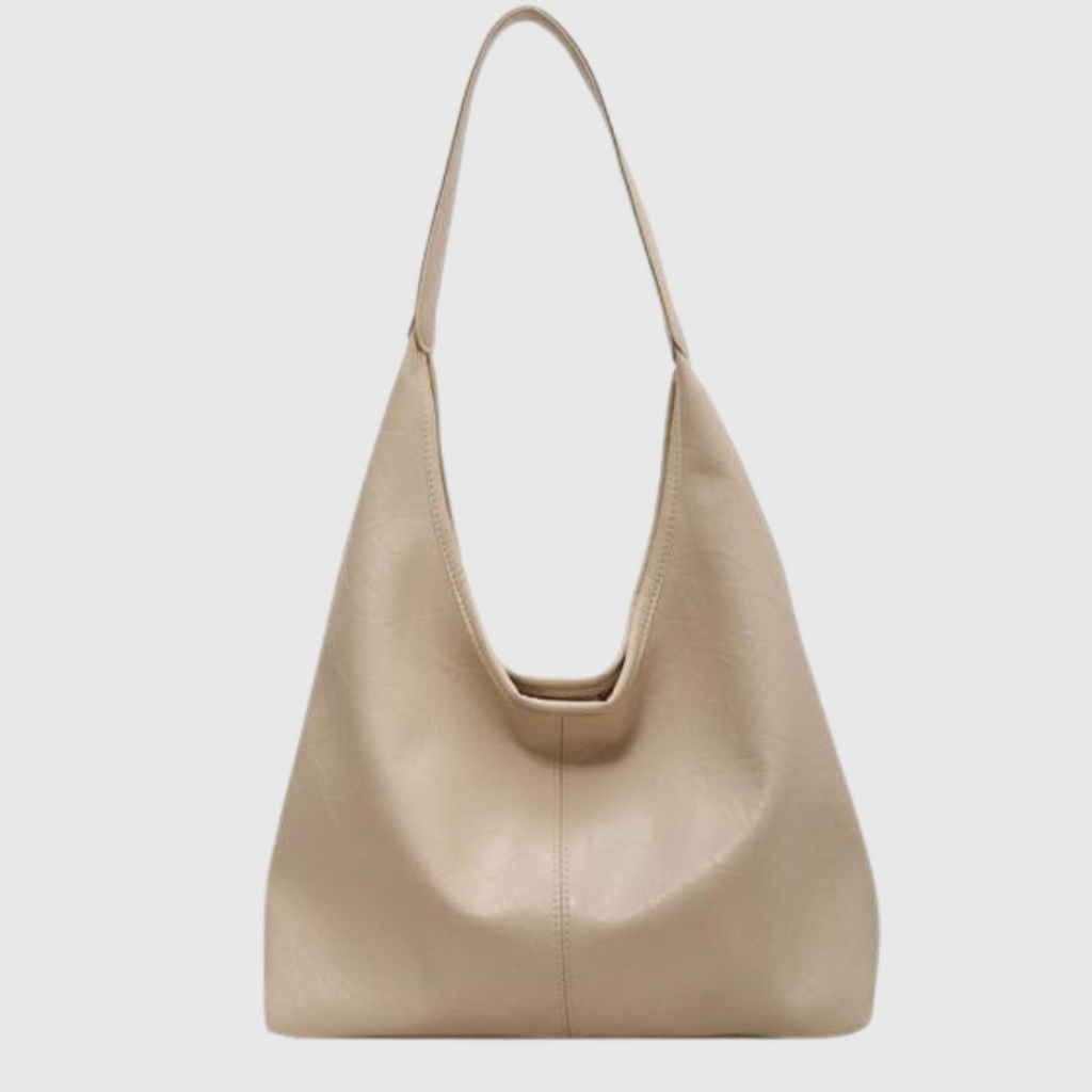 Sac à main beige en cuir, design minimaliste, bandoulière fine. Accessoire mode élégant pour femme, tendance et chic.