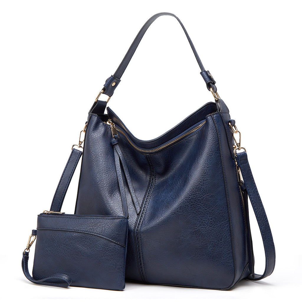 Sac à main en cuir bleu avec pochette assortie, design élégant, bandoulière réglable, idéal pour mode féminine, accessoires tendance.