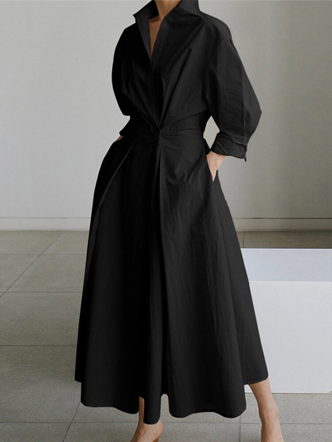 Robe noire élégante longue avec manches longues et col chemise, style minimaliste, mode féminine moderne, tenue chic pour soirée ou événement formel.