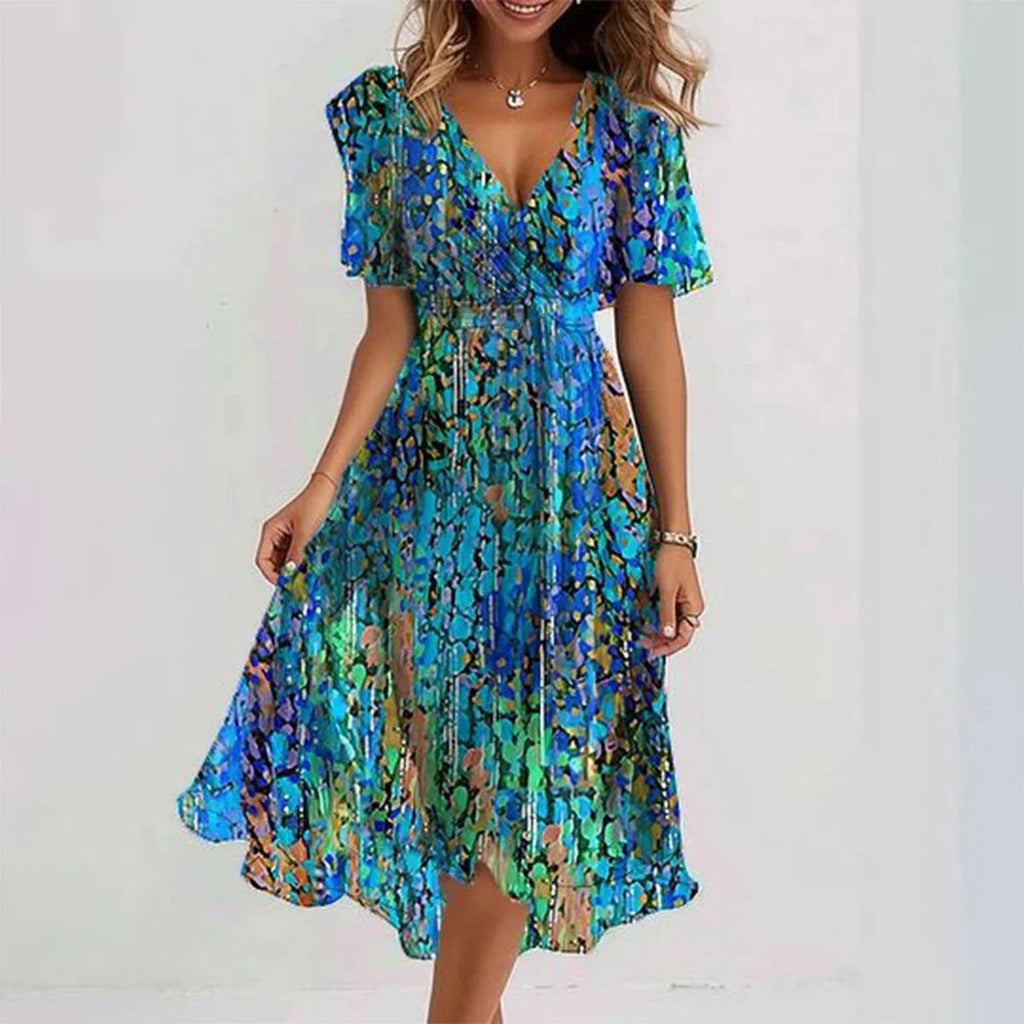 Robe d'été femme, imprimé floral bleu et vert, manches courtes, col en V, style décontracté, idéale pour la plage ou sorties estivales.