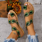 Flat sandal with strap trim