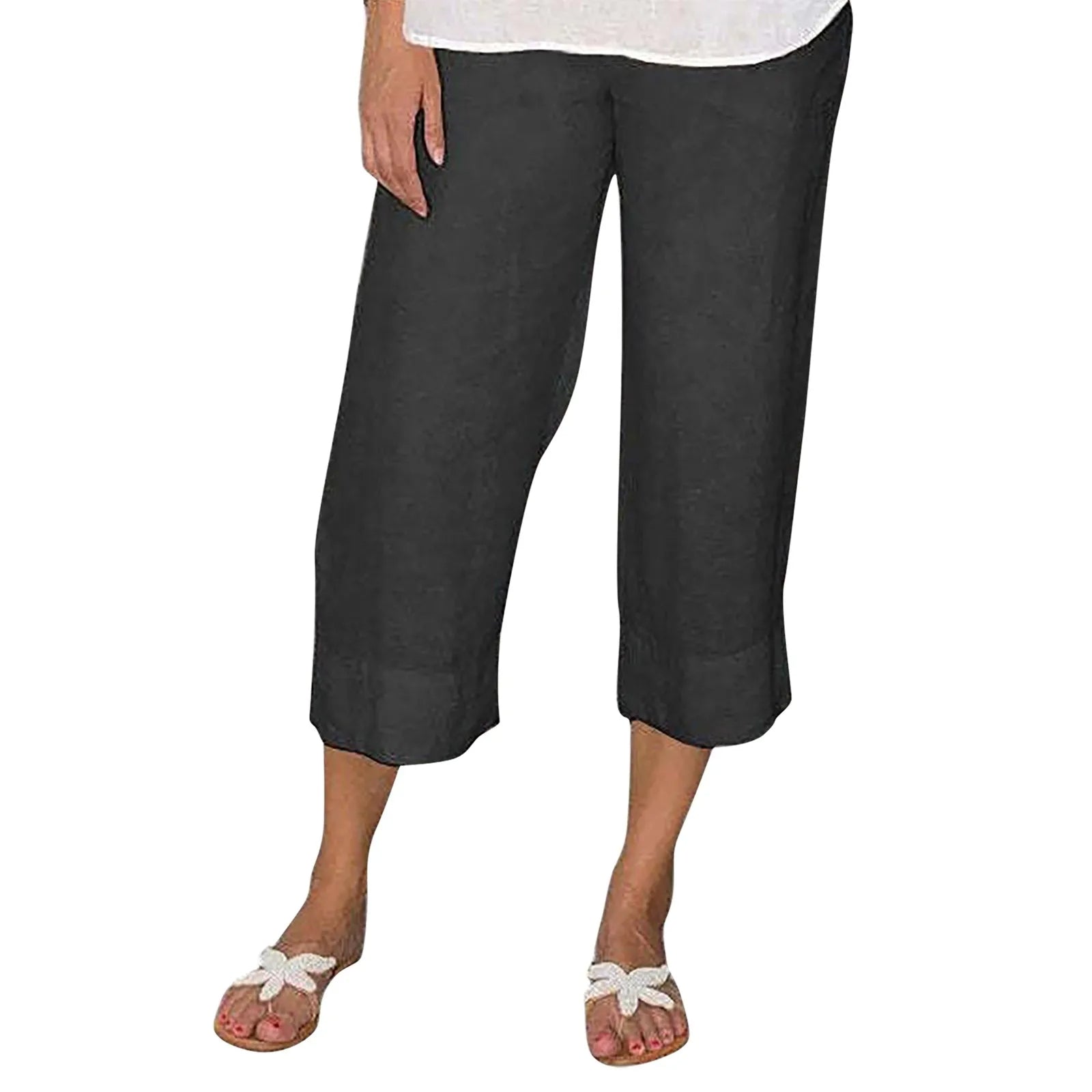 Pantalon capri noir en lin pour femme, coupe ample, longueur mi-mollet, idéal pour l'été. Mode décontractée, confort et style.