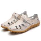 Chaussures de marche confortables en cuir beige pour femmes, semelle antidérapante, design aéré, idéales pour randonnée et activités extérieures.