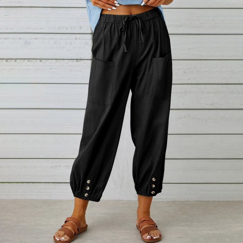 Pantalon noir ample pour femme avec poches avant, boutons décoratifs aux chevilles, style décontracté, idéal pour l'été.