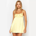 Yellow satin mini dress with straps and zipper closure