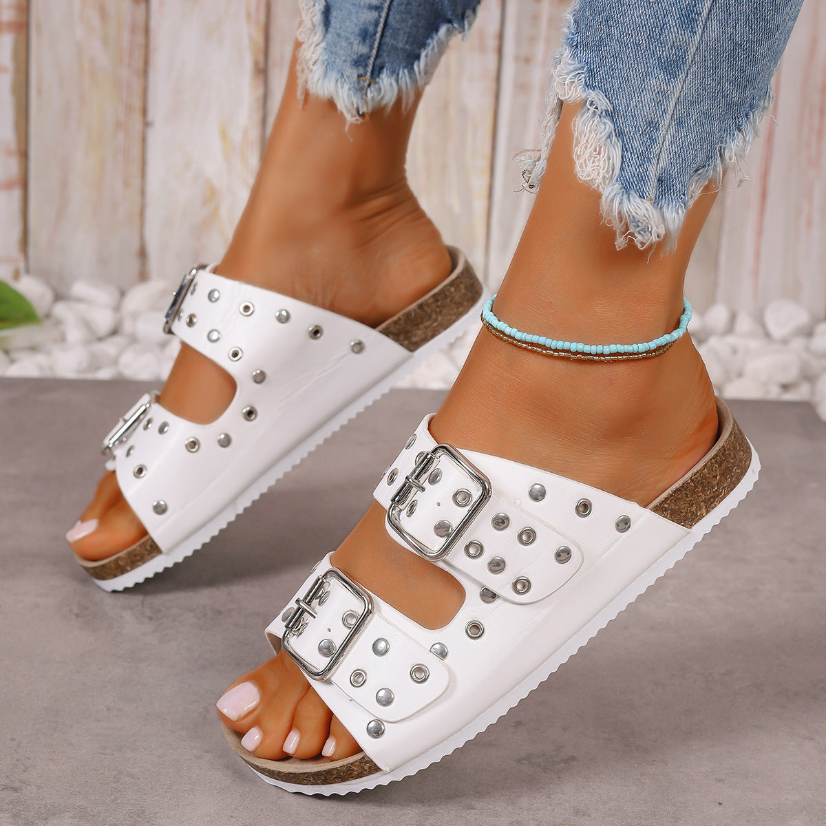 Flat sandal with stud detail
