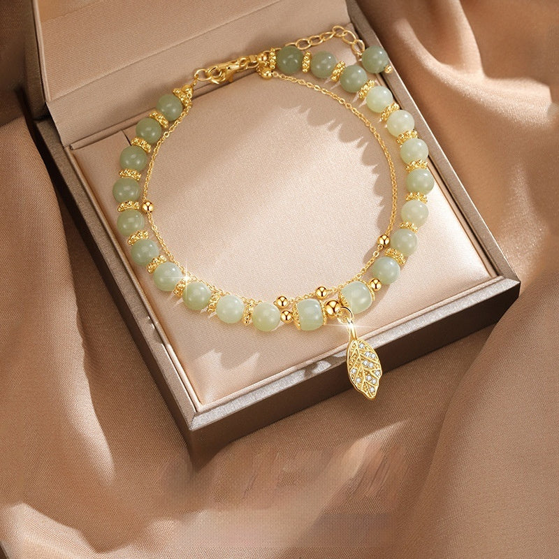 Chinese beaded bracelet with leaf pendant