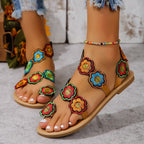 Flat sandal with strap trim