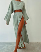 Tenue estivale femme: ensemble vert clair en lin, haut ample à manches longues et jupe fendue, style décontracté et élégant, mode tendance.