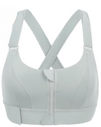 Soutien-gorge de sport gris clair avec fermeture éclair frontale, bretelles croisées, sans armature, idéal pour fitness et yoga.