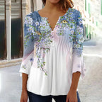 Blouse femme à manches longues, dégradé bleu et blanc, motif floral, rue pavée. Mode féminine, tendance printemps, style décontracté élégant.