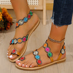 Flat sandal with strap trim