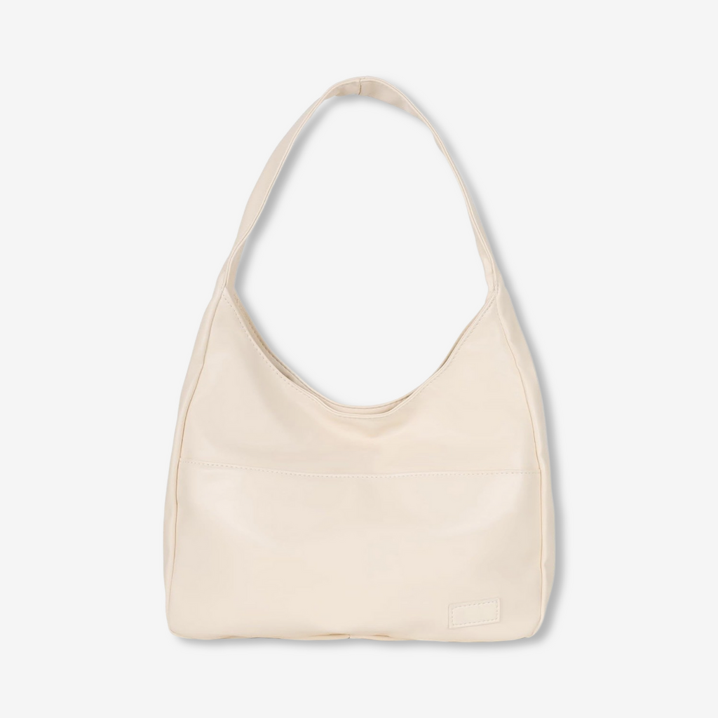 Sac à main en cuir beige élégant avec anse unique, design minimaliste. Accessoire mode femme tendance, parfait pour un look chic et moderne.