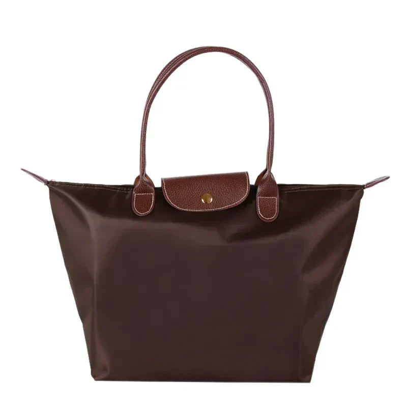 Sac à main en cuir marron, design élégant avec poignées doubles, idéal pour femme. Accessoire mode tendance, parfait pour toutes occasions.
