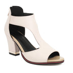 Sandale à talon haut blanc cassé pour femme, design moderne avec découpe élégante, semelle noire et détail rouge, idéale pour l'été.