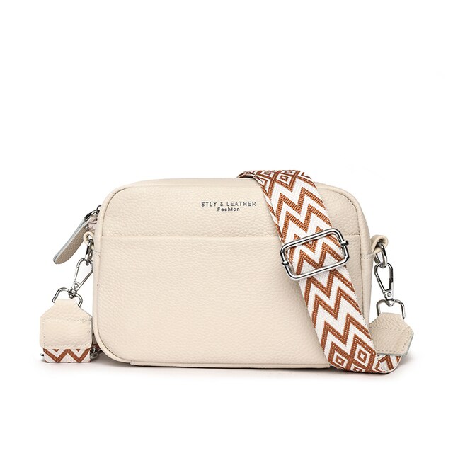 Sac à main en cuir beige avec bandoulière à motifs géométriques marron et blanc, design moderne, idéal pour la mode féminine.
