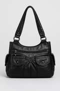 Sac à main noir en cuir avec poches avant, fermetures éclair et détails en forme de cœur. Élégant et pratique pour un usage quotidien.