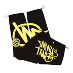 Pantalon noir streetwear avec motifs jaunes graffiti, style urbain moderne, cordons ajustables, idéal pour mode jeune et tendance.