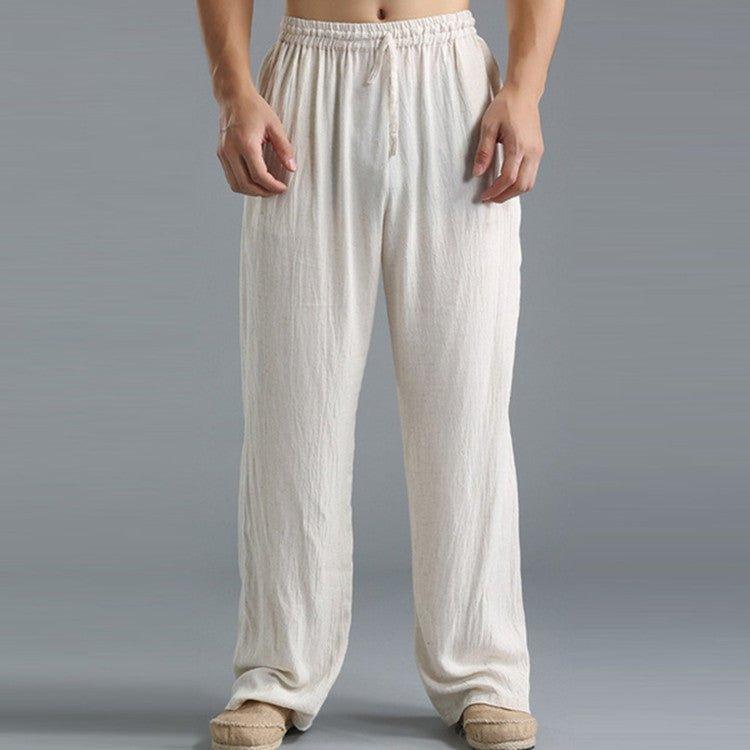 Pantalon ample en lin blanc pour homme, style décontracté, taille élastique, idéal pour l'été et les loisirs. Confort et élégance assurés.