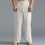Pantalon ample en lin blanc pour homme, style décontracté, taille élastique, idéal pour l'été et les loisirs. Confort et élégance assurés.