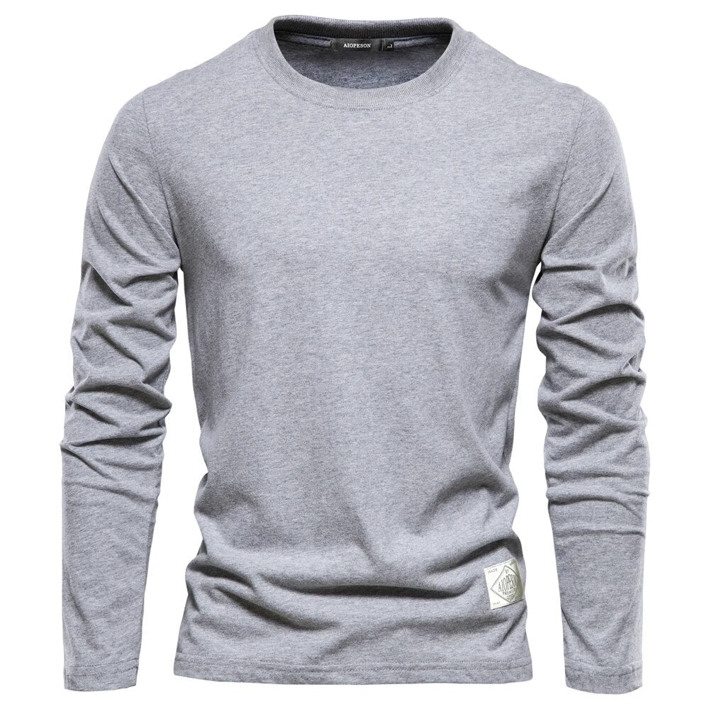 T-shirt gris à manches longues pour homme, col rond, style décontracté, tissu en coton, idéal pour mode automne-hiver, vêtement basique polyvalent.