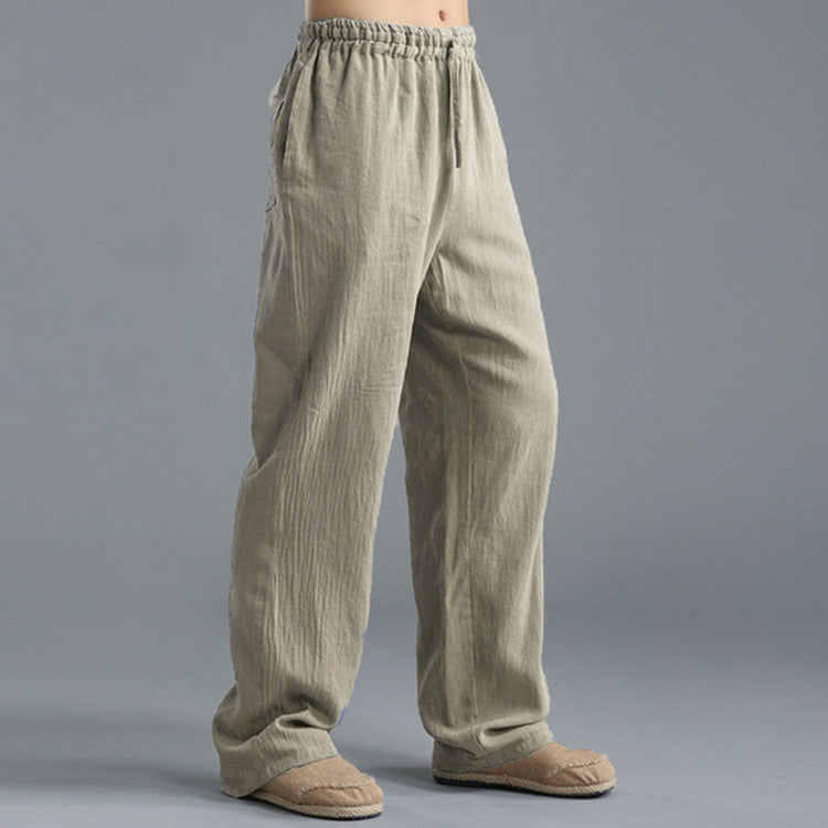 Pantalon ample en lin beige pour homme, taille élastique, poches latérales, style décontracté. Mode masculine, confort, vêtements légers.