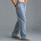 Pantalon ample en lin bleu clair pour homme, style décontracté, avec taille élastique et poches latérales, idéal pour l'été et le confort quotidien.