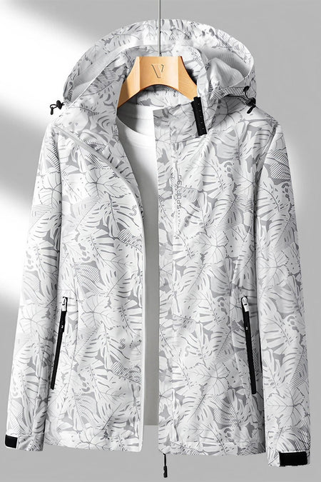 Veste imperméable à capuche pour femme, motif tropical blanc et gris, fermeture éclair, poches zippées, idéale pour randonnée et activités extérieures.
