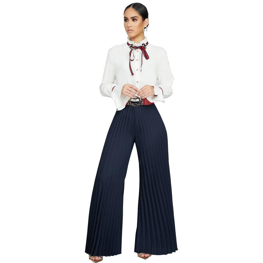 Pantalon à jambe large Pli de couleur unie