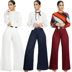 Pantalon jambe large à pli de couleur unie