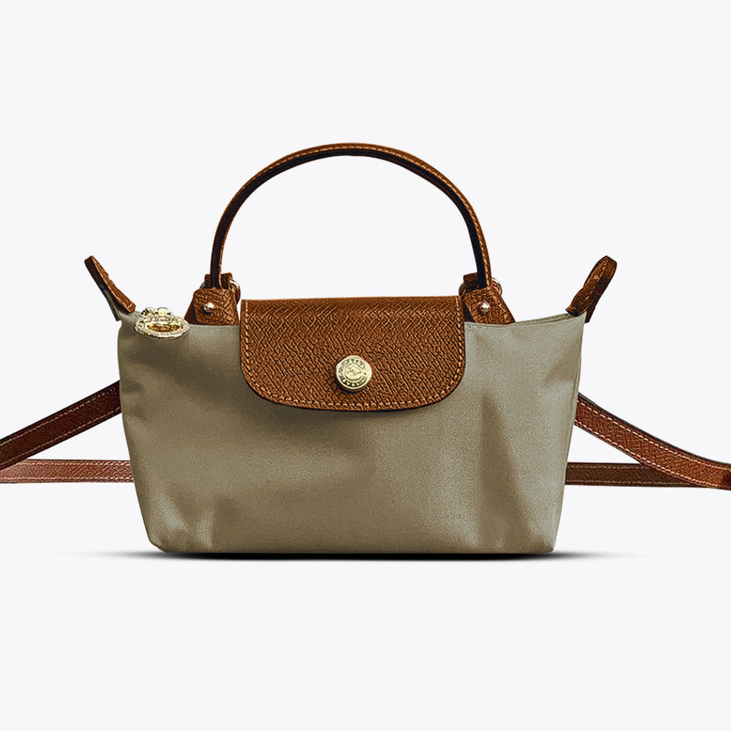 Sac à main en cuir marron et tissu beige, design élégant, avec bandoulière ajustable. Accessoire mode femme, tendance et chic.
