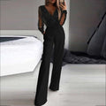 Combinaison noire élégante pour femme avec manches transparentes et détails perlés, idéale pour soirées chic et mode tendance.