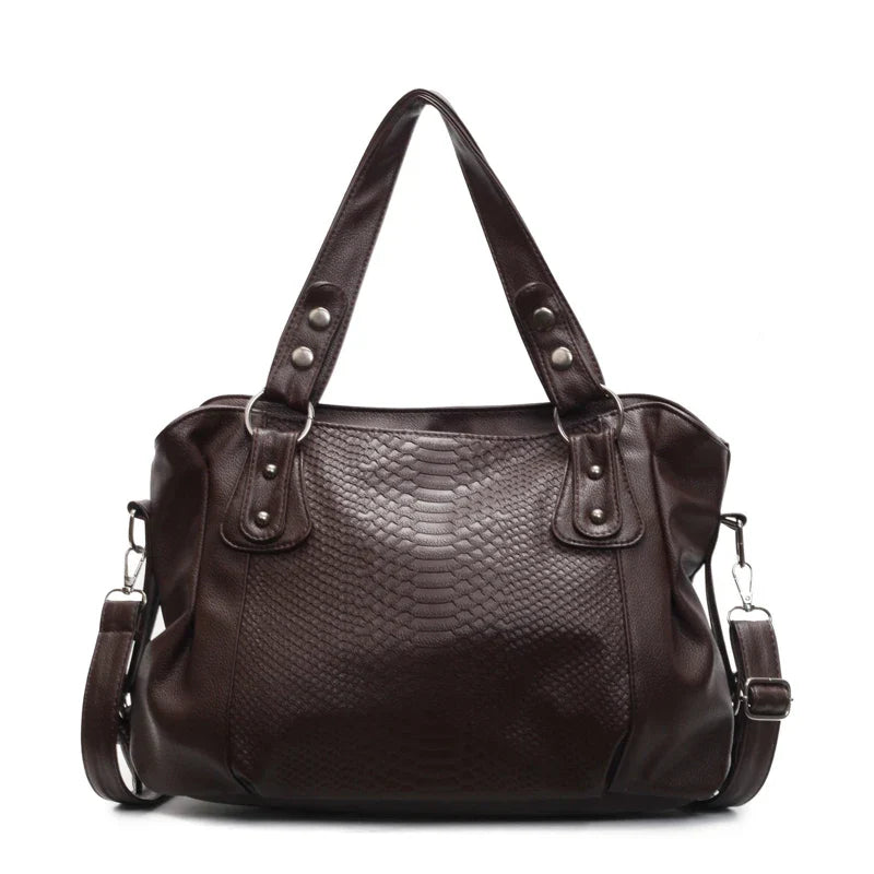 Sac à main en cuir marron foncé avec motif serpent, anses robustes et bandoulière amovible. Élégant et spacieux pour un usage quotidien.