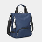 Sac à dos bleu Tigernu en nylon, design moderne, avec poches zippées et bandoulières ajustables, idéal pour le voyage et le quotidien.